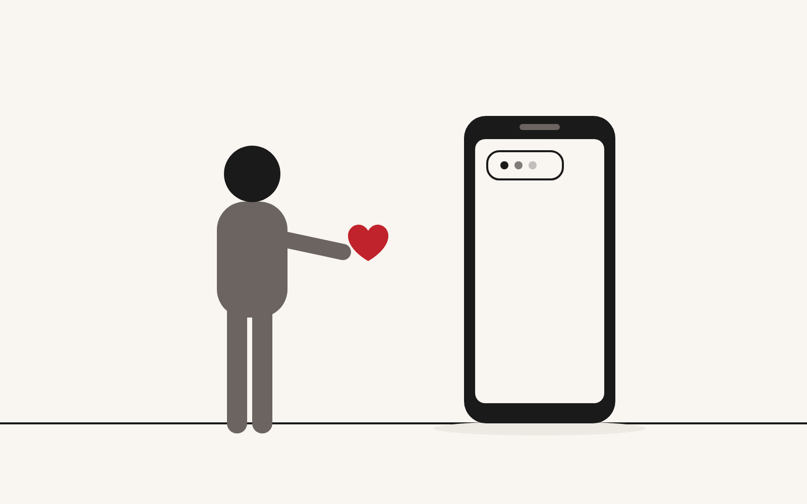 Humanizar la inteligencia artificial: una persona le ofrece un corazón a un móvil que solo responde «escribiendo»